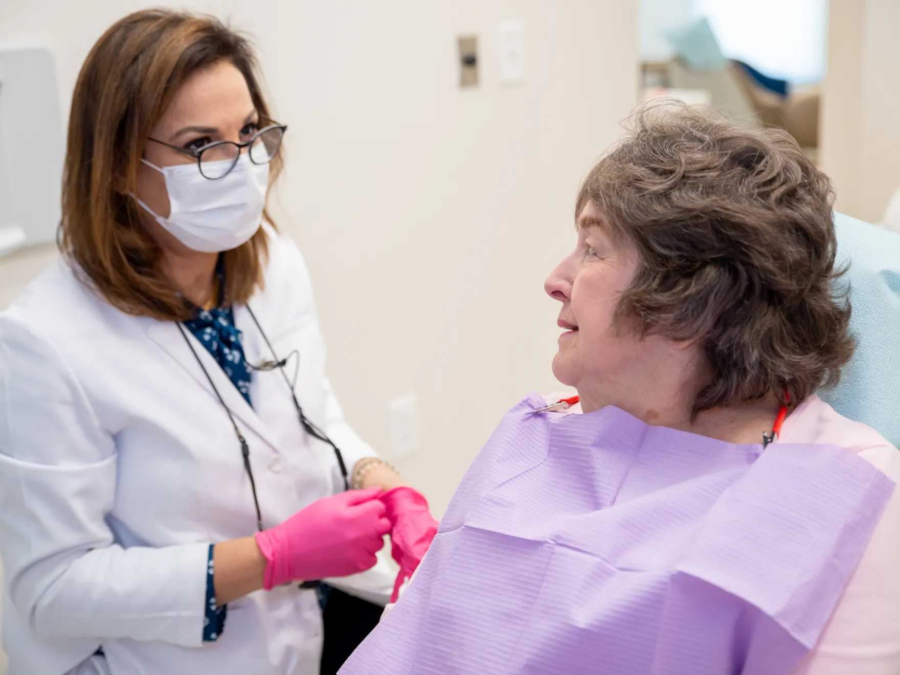 Dr. Bahrami talking to patient.